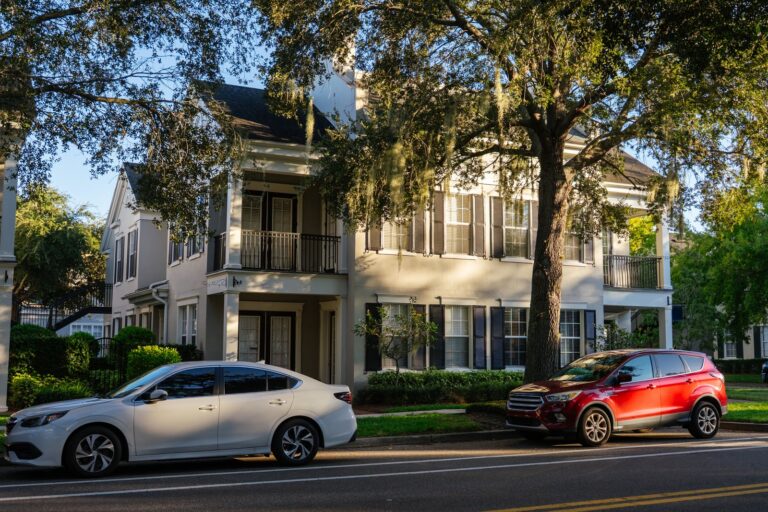 Longwood area home on a street shaded by oak trees with Spanish moss